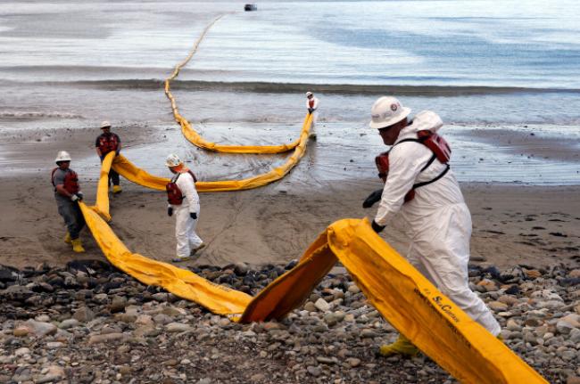 Workers prepare an oil containment boom at Refugio State Beach, north of Goleta, Calif., two days after a ruptured pipeline created the largest coastal oil spill in California in 25 years. AP