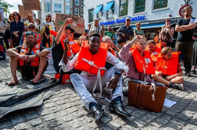 Hundreds gather in Amsterdam in solidarity with Carola Rackete, captain of the Sea-Watch 3 ship, who was arrested after a two-week standoff with Italian officials, in Amsterdam, July 4, 2019. ANA FERNANDEZ / SOPA IMAGES / LIGHTROCKET VIA GETTY IMAGES