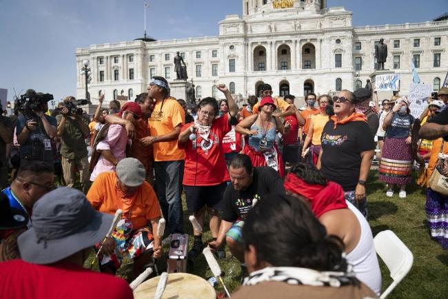 Water protector protesters dance and sing along to drumming during a protest against Line 3 and other pipeline projects at the State Capitol in St. Paul, Minn., on Wednesday. (Renee Jones Schneider/Star Tribune via AP)