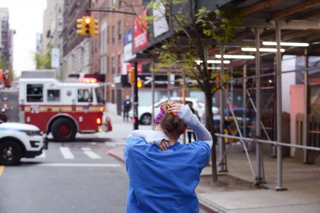 A tired nurse leaves Mt. Sinai Morningside hospital in New York City, on April 23, 2020. B.A. VAN SISE / NURPHOTO VIA GETTY IMAGES