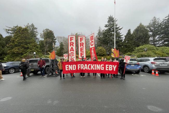 Protestors gathered outside Government House in Victoria on Dec. 7, 2022 to fight against proposals that would see an expansion in the fossil-fuel industry in B.C. (Hollie Ferguson/News Staff)
