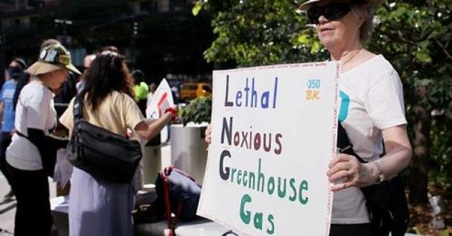 A woman takes part in a protest against fracked gas exports on June 15, 2022 in New York. (Photo: John Smith/VIEWpress)