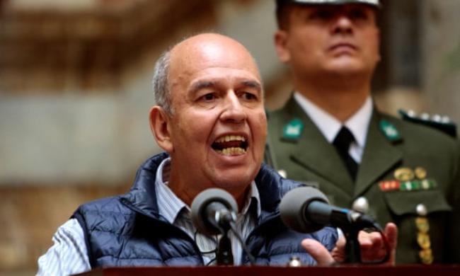 Arturo Murillo speaks to the media in La Paz. He says a recording shows the former president giving orders that would lead to citizens being starved. Photograph: Reuters