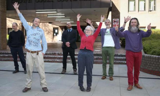 Extinction Rebellion protesters (left to right) Ian Bray, James ‘Sid’ Saunders, Simon Bramwell, Jane Augsburger, David Lambert and Senan Clifford outside Southwark Crown Court after being cleared. Photograph: Yui Mok/PA