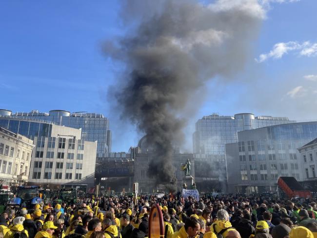photo: Burning piles of hay sent up dark plumes of smoke in Brussels on February 1, as farmers protests sweep through Europe. Rachel Sherrington.