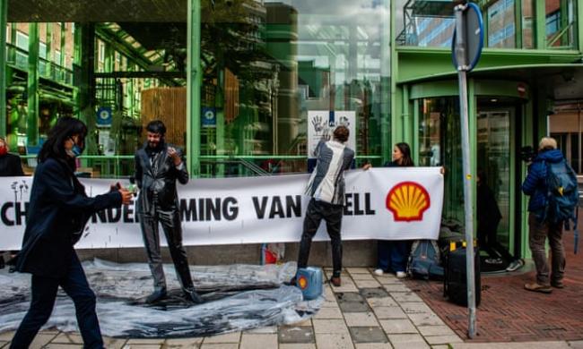 Climate activists protest against Shell in The Hague in October. Photograph: Ana Fernandez/SOPA Images/Rex/Shutterstock