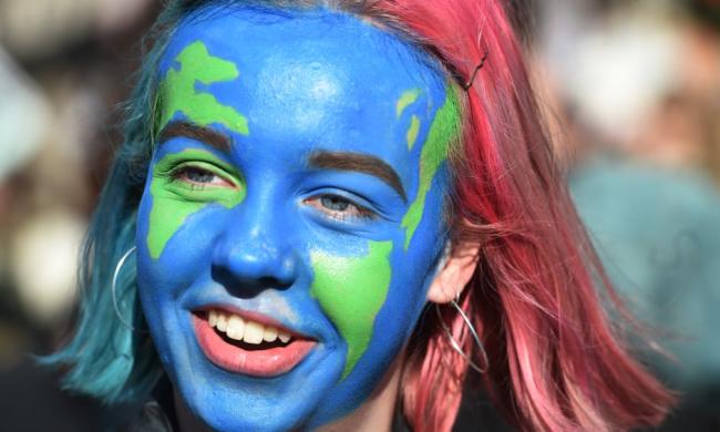 One of the youth climate strikers in Parliament Square. Photograph: Facundo Arrizabalaga/EPA