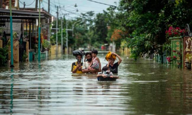 ‘In 2020 we saw deadly floods in Indonesia (above), bushfires in Australia, both drought and record rainfall in China and extreme storms from the Philippines to Nicaragua.’ Photograph: Juni Kriswanto/AFP/Getty Images