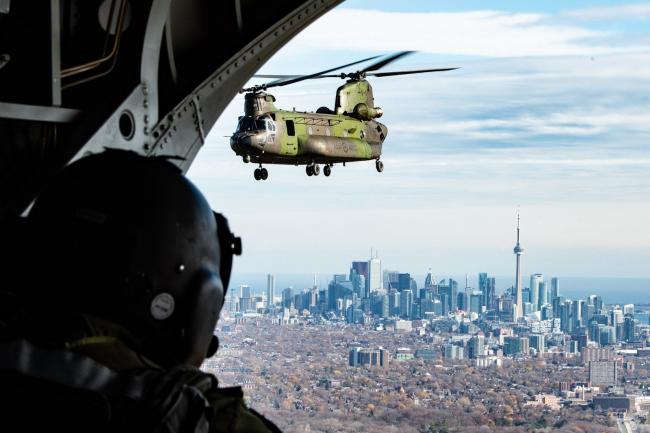 Members of 450 Tactical Helicopter Squadron fly over Toronto for Remembrance Day. Photo by aviator Lanny Jellicoe / Garrison Petawawa Imaging
