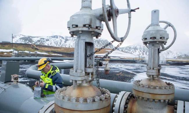 A worker on a Carbfix carbon injection well in Iceland in 2017. The company is involved in the new Orca plant designed to draw carbon dioxide out of the air and store it as rock. Photograph: Christian Science Monitor/Getty Images