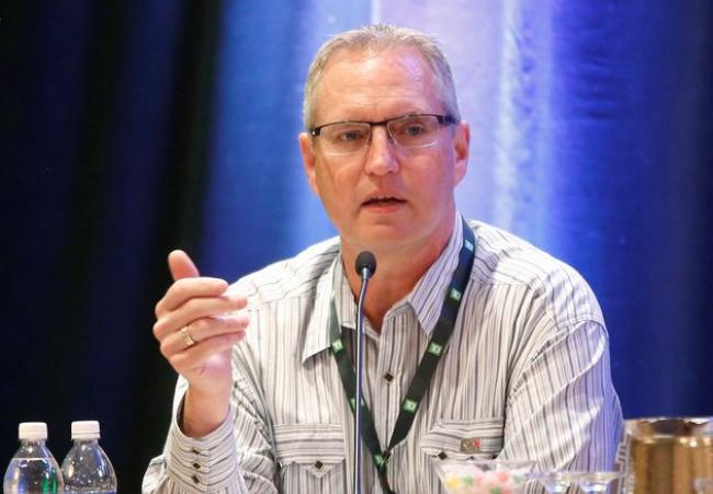 TODD KOROL / REUTERS Suncor Energy president and CEO Mark Little speaks at the TD Securities Calgary Energy Conference in Calgary, July 9, 2019. 