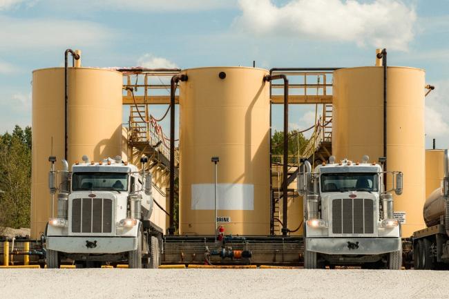 Brine trucks at an Injection well in Cambridge, OH. George Etheredge for Rolling Stone.