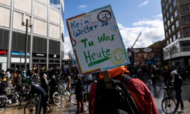 Environmental activists protest in Berlin in March. The report shows a significant increase in consumption of fossil fuels across building, industrial and transport sectors Photograph: Maja Hitij/Getty Images