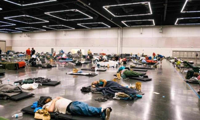‘People rest at the Oregon Convention Center cooling station in Oregon, Portland on June 28, 2021, as a heatwave moves over much of the United States’ Photograph: Kathryn Elsesser/AFP/Getty Images