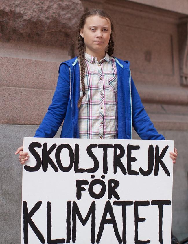 In August 2018, outside the Swedish parliament building, Greta Thunberg started a school strike for the climate. Her sign reads, “Skolstrejk för klimatet,” meaning, “school strike for climate”. Author : Anders Hellberg [CC BY-SA 4.0]