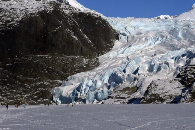 People walk near the Mendenhall Glacier on Feb. 9, 2025, in Juneau, Alaska. (AP Photo/Becky Bohrer, File)