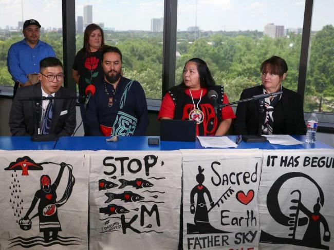 Photo: Godofredo A. Vasquez / Houston Chronicle Attorney Eugene Kung, left to right, Dr. Tane Ward, Neskonlith te Secwepemc chief Judy Wilson, and Sum of Us capitol markets advisor Lisa Lindsley talk during a press conference in Houston following an appearance at Kinder Morgan International's Annual General Meeting on May 9, 2018. Wilson talked about the opposition to the Trans Mountain Pipeline.