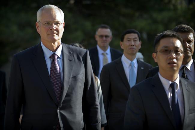 Exxon Mobil chairman and CEO Darren Woods arrives for a meeting with Chinese Premier Li Keqiang in Beijing in 2018.