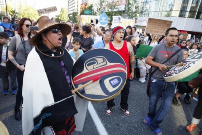 First Nations drummers on street after Northern Gateway decision