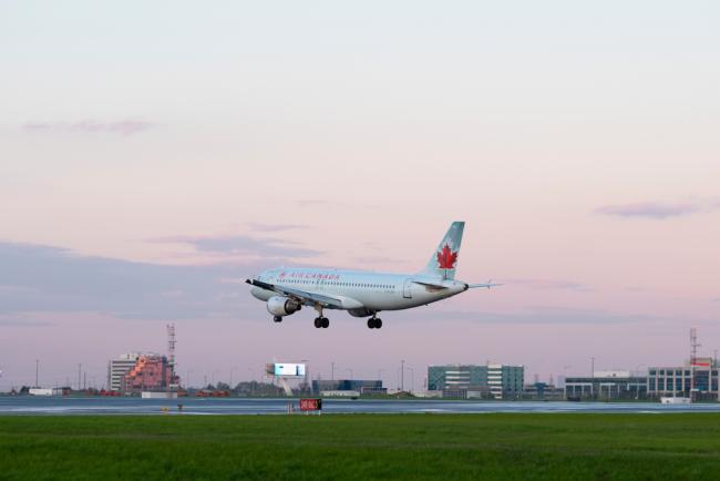 Air Canada plane landing - We’re bailing out Air Canada with a near $6-billion package. Will we get our money’s worth? Photo via Shutterstock.