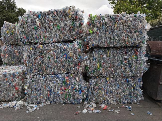 Bales of crushed, polyethylene terephthalate (PET) plastic bottles in California (Wikimedia Commons)