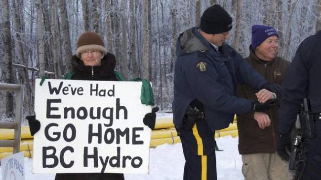 Penny Boden, left, and Arthur Hadland were two of three people arrested for blocking traffic and refusing to move at a Jan. 6 protest against the Site C dam outside Fort St. John, B.C. (Bronwyn Scott/Alaska Highway News)