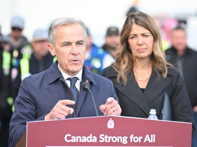 Mark Carney announced Thursday, alongside Danielle Smith in Fort McMurray, that the West Coast pipeline will go ahead as a project in the national interest. Photo by Greg Halinda, the Canadian Press.