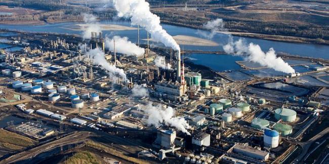 A view of the oil sands in Fort McMurray, Alta., pictured in 2008. The 'energy transition' has given way to energy security, while war has added to increasingly harmful weather in lowering agriculture production globally, writes Bill Henderson The Hill Times file photograph