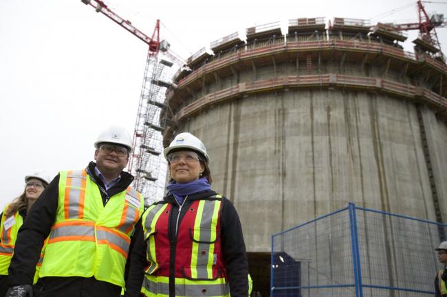 B.C. Premier Christy Clark (center) in front of the Tilbury LNG expansion tank in Delta, B.C, south of Vancouver last week. Photo by Mychaylo Prystupa.