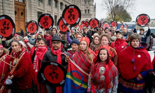  Indigenous activists lead the Red Lines action in Paris at the end of the UN climate negotiations on December 12, 2015. Photograph: Allan Lissner