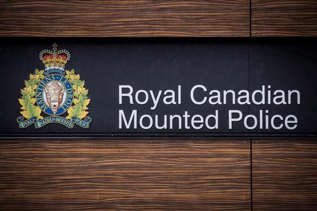 The RCMP logo is seen outside Royal Canadian Mounted Police "E" Division Headquarters, in Surrey, B.C., on Friday, April 13, 2018. File photo by The Canadian Press/Darryl Dyck