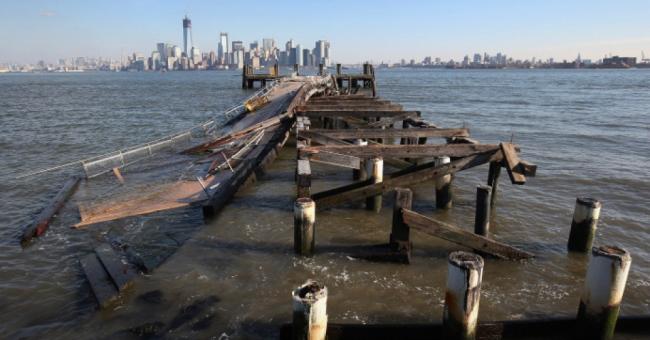 A dock sits damaged near the Statue of Liberty, which remained closed to the public six weeks after Hurricane Sandy on December 13, 2012 in New York City. (Photo: John Moore/Getty Images)