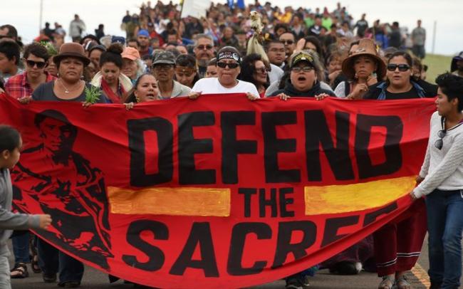 Native Americans march to a burial ground sacred site that was disturbed by bulldozers building the Dakota Access Pipeline. Photo: AFP