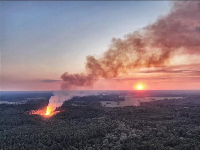 Main image: Screen shot from drone video of the fracked gas well blowout, at a well operated by GEP Haynesville, LLC, in Red River Parish, Louisiana. Credit: Phin Percy Jr., used with permission