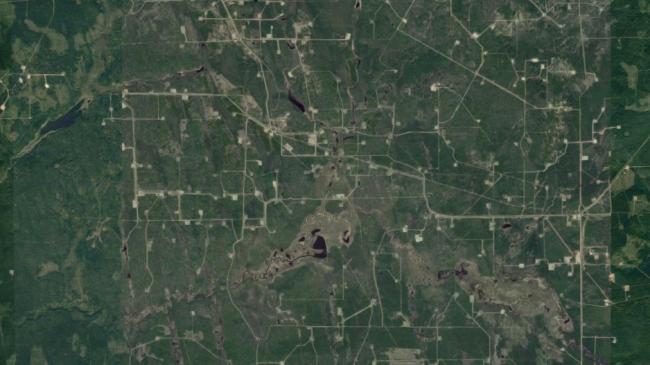 Roads and pipelines for natural gas wells stitch the countryside in the Fort St. John-Dawson Creek area -- one of the many cumulative impacts that made up First Nation's treaty infringement claim. | Google Maps