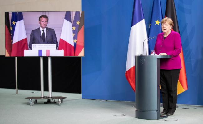 German chancellor Angela Merkel and French president Emmanuel Macron, seen present live via video, speak to the media at the Chancellery during the coronavirus crisis on May 18, 2020 in Berlin, Germany. Andreas Gora - Pool / Getty