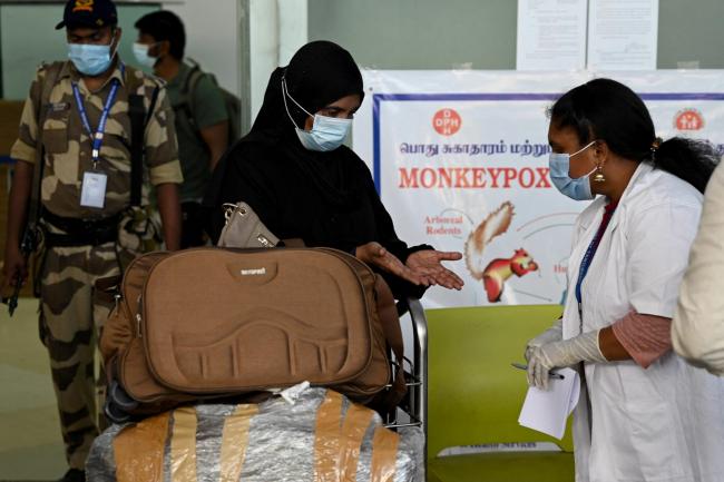 Health workers screen passengers arriving from abroad for monkeypox symptoms at Anna International Airport terminal in Chennai on June 03, 2022. Credit: Arun Sankar/AFP via Getty Images