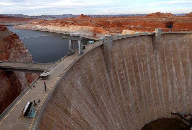 PAGE, ARIZONA - MARCH 27: A view of the Glen Canyon Dam at Lake Powell on March 27, 2022 in Page, Arizona. As severe drought grips parts of the Western United States, water levels at Lake Powell dropped to their lowest level since the lake was created by the damming the Colorado River in 1963. Lake Powell is currently at 25 percent of capacity, a historic low, and has also lost at least 7 percent of its total capacity. The Colorado River Basin connects Lake Powell and Lake Mead and supplies water to 40 mill