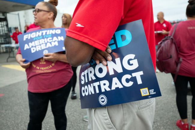 Stellantis workers attend a "members' handshake" event with UAW president Shawn Fain to mark the beginning of contract negotiations, July 12, 2023, in Sterling Heights, Michigan. (Bill Pugliano / Getty Images)