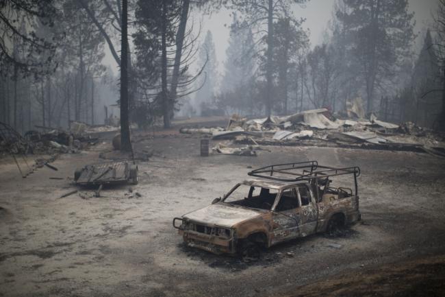 A burned truck and structures are seen in the wake of the Butte Fire, which burned over 70,000 acres, on September 13, 2015, near San Andreas, California. DAVID MCNEW / GETTY IMAGES