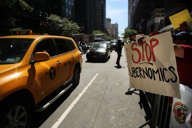 New York City drivers rally against Uber in 2015. SPENCER PLATT/ GETTY IMAGES