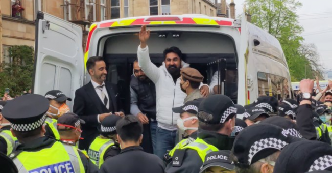 Two refugees were released by immigration enforcement agents Thursday evening after about 200 local residents held an impromptu protest as the men were loaded into a van. (Photo: @KimJohnsonMP/Twitter)
