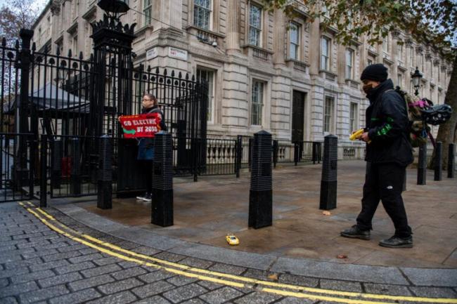 Greenpeace activists drove remote-control electric toy cars under the security gates of Downing Street