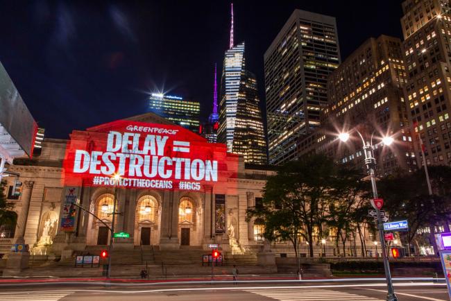 Greenpeace USA activists project messages calling for ocean protection onto New York's public library. Photo ©  POW / Greenpeace