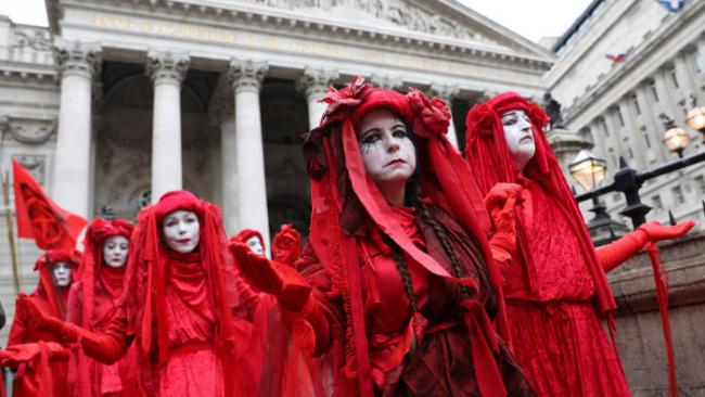 Activists dressed in red demonstrate outside the Royal Exchange in the City of London as part of a wave of protests by Extinction Rebellion in October © Isabel Infantes/AFP/Getty
