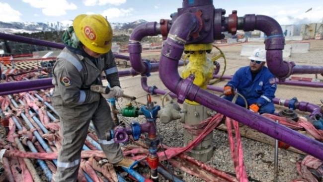 Hydraulic fracturing involves pumping water and chemicals deep into the earth to fracture shale rock beds and release natural gas for extraction. ( (Brennan Linsley/The Associated Press))