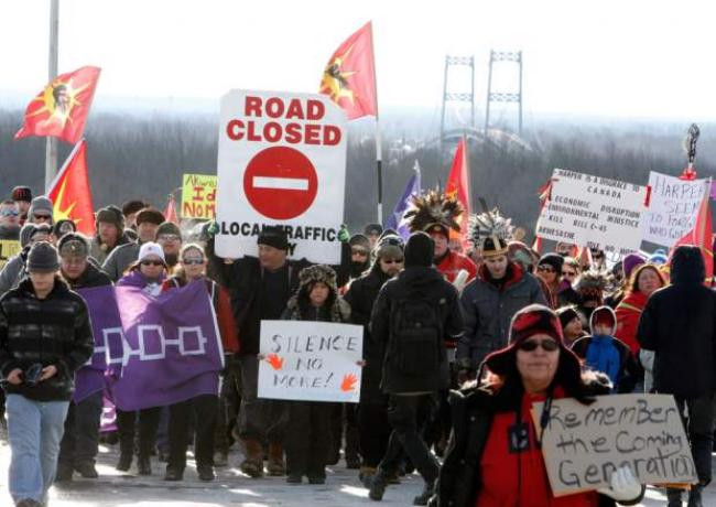 First Nations Idle No More protestors march and block the International Bridge between the Canada and U.S. border near Cornwall Ontario, Saturday January 5 2013., THE CANADIAN PRESS/Fred Chartrand/File