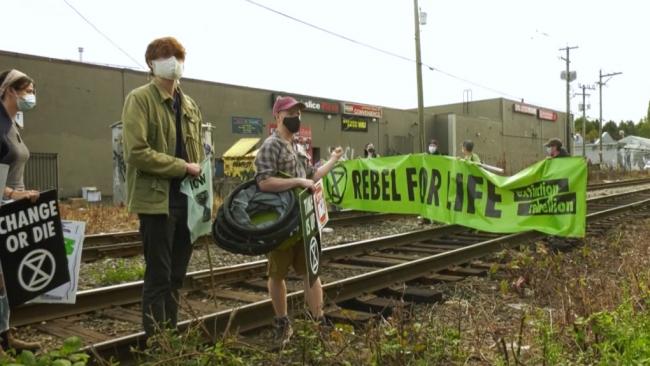 Protesters from the group Extinction Rebellion block the railway tracks in East Vancouver on Sept. 21, 2020.