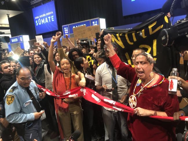 UN security struggles to control an unprecedented protest inside the climate negotiations. Dec. 11, 2019. Photo National Observer