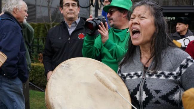 An Indigenous protester demonstrates outside the National Energy Board hearings for Kinder Morgan's Trans Mountain expansion project in Burnaby, B.C. on Jan. 19, 2016. Photo by Elizabeth McSheffrey.